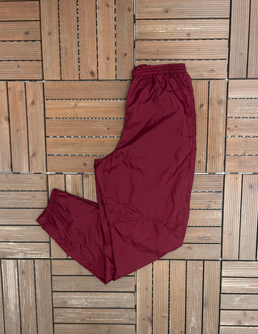 Nike Embroidered Graphic Track Pants | Size Medium | Vintage 1990s Nike Branded Red Trackpants |