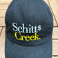 Schitt's Creek Embroidered Graphic Hat | Snap Back | Television Promotional Black Cap |