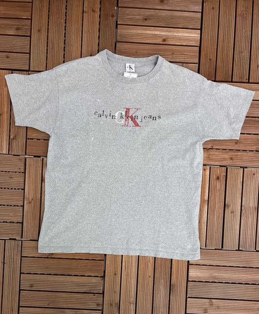 Calvin Klein Jeans Spell Out Graphic Tee | Size L/XL | Vintage 2000s Branded Distressed Grey T-Shirt | Free Shipping to USA |